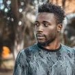 Man photographed outdoors in Kampala
