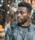 Man photographed outdoors in Kampala