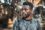 Man photographed outdoors in Kampala
