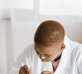 Black technician repairing computer hardware