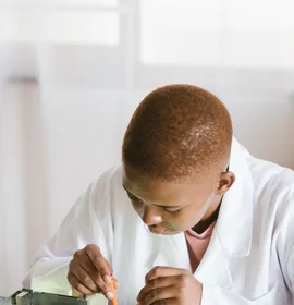 Black technician repairing computer hardware