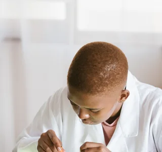 Black technician repairing computer hardware