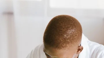 Black technician repairing computer hardware