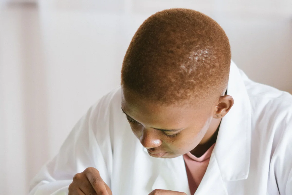 Black technician repairing computer hardware