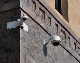 Modern surveillance cameras mounted on a building