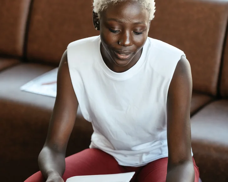 Black businesswoman reviewing documents at a desk