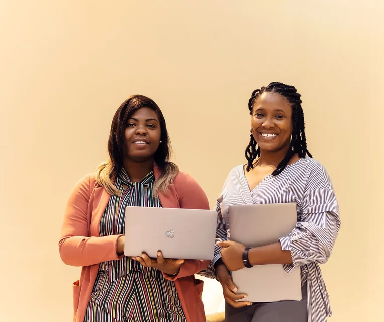 African businesswomen collaborating with laptops