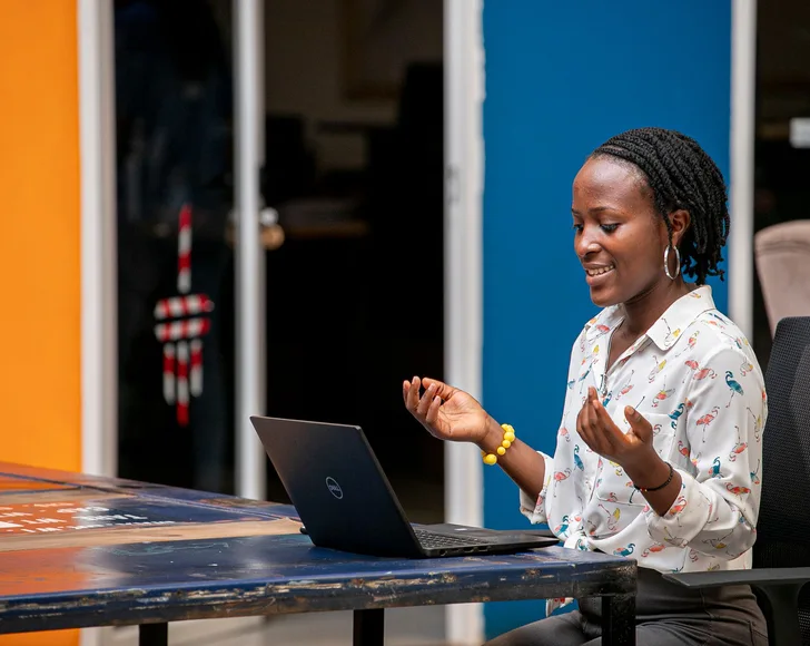 Woman using a laptop in Kampala