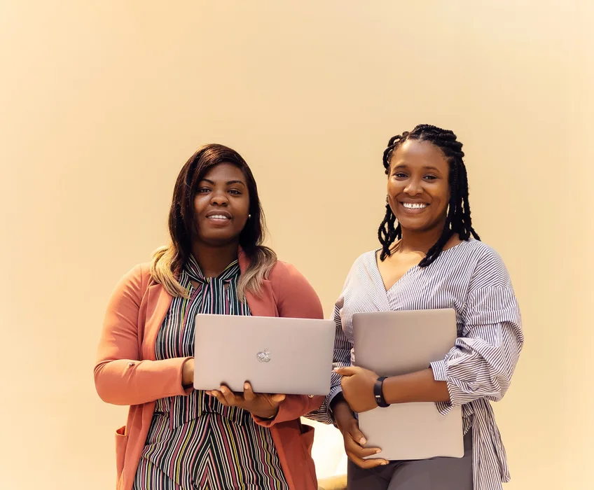 African businesswomen collaborating with laptops