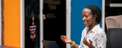 Woman using a laptop in Kampala