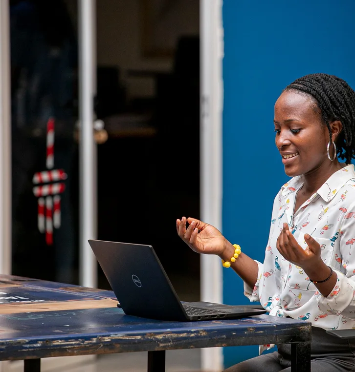 Woman using a laptop in Kampala