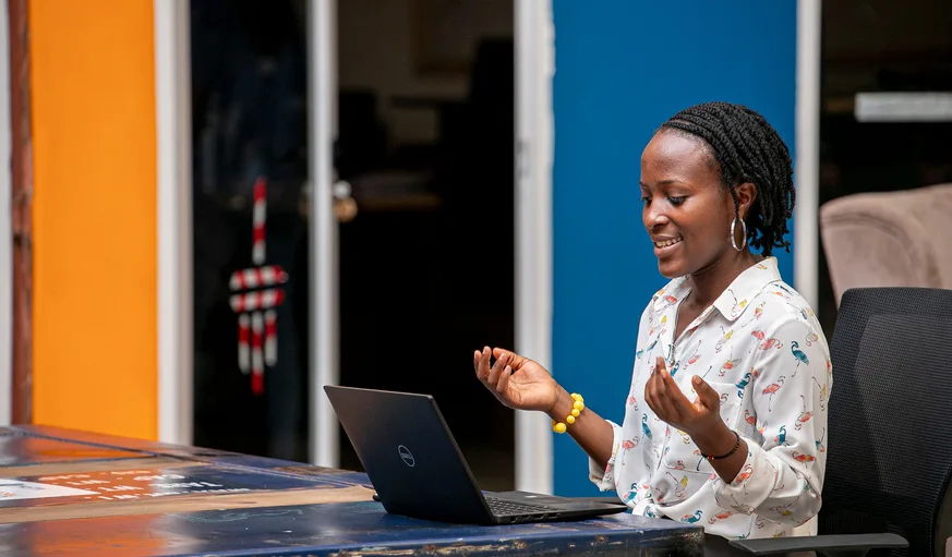 Woman using a laptop in Kampala
