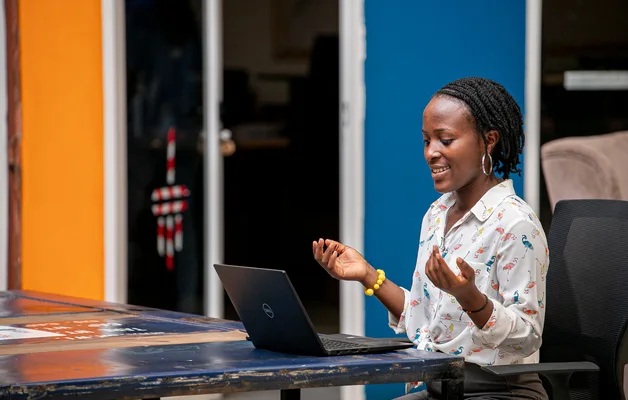 Woman using a laptop in Kampala