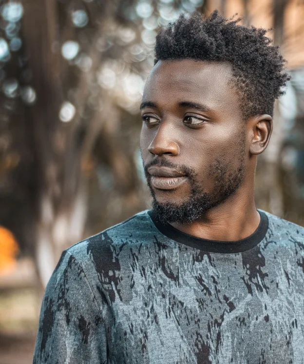 Man photographed outdoors in Kampala
