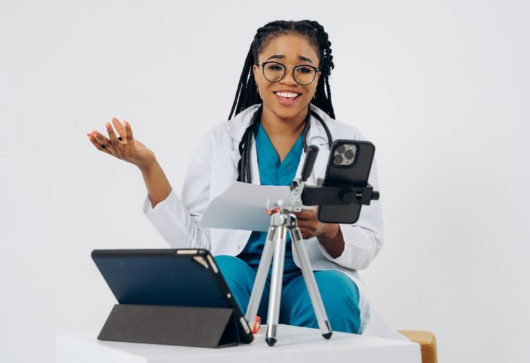 Black female doctor providing an online consultation