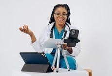 Black female doctor providing an online consultation