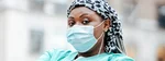 Black female doctor wearing a medical mask
