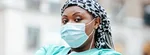 Black female doctor wearing a medical mask