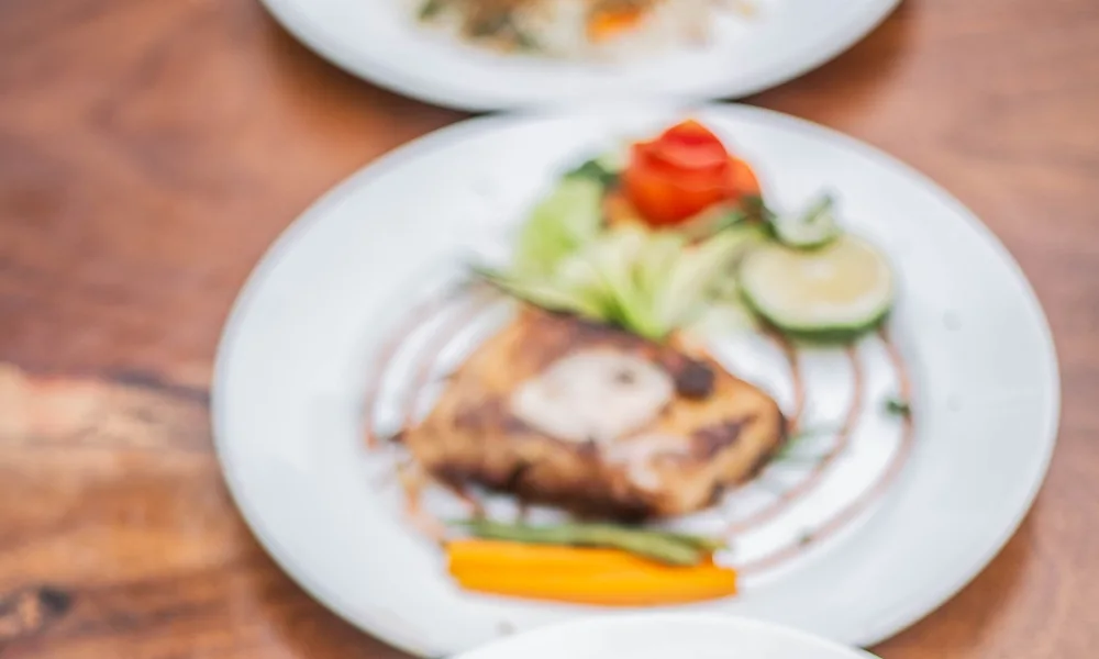 Three colourful plated dishes photographed in Uganda