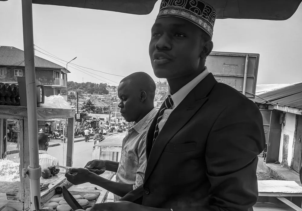 Street vendor preparing a Ugandan rolex in Kampala