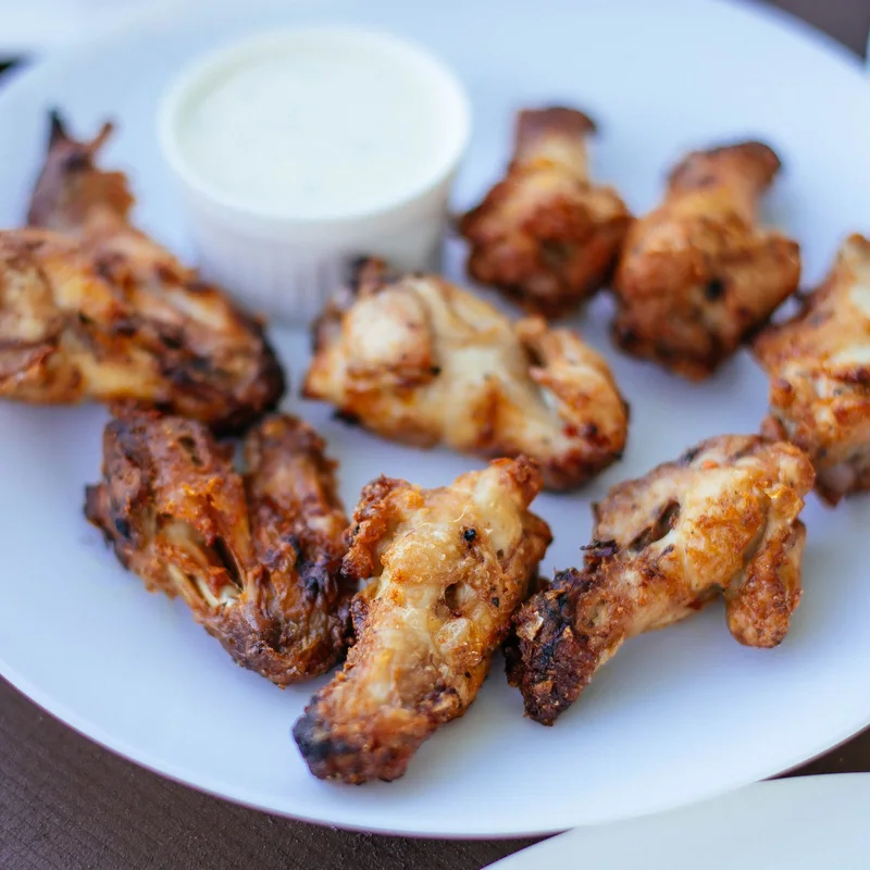 Chicken wings served with dipping sauce