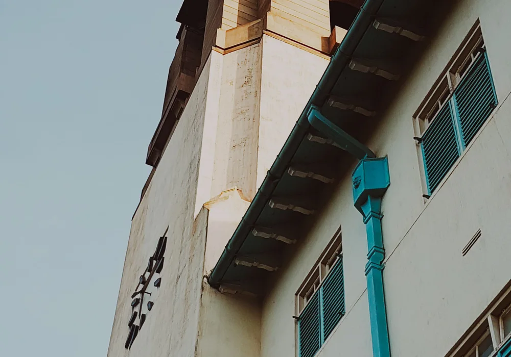 Building facade with blue shutters in Kampala