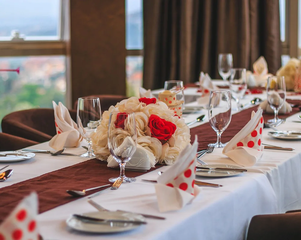 Dining tables set beside windows in Kampala
