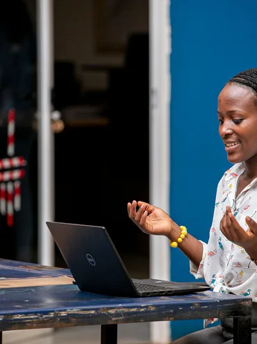 Woman using a laptop in Kampala