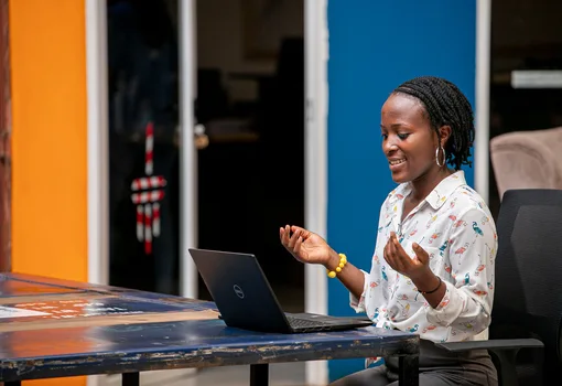 Woman using a laptop in Kampala