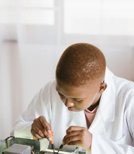 Black technician repairing computer hardware