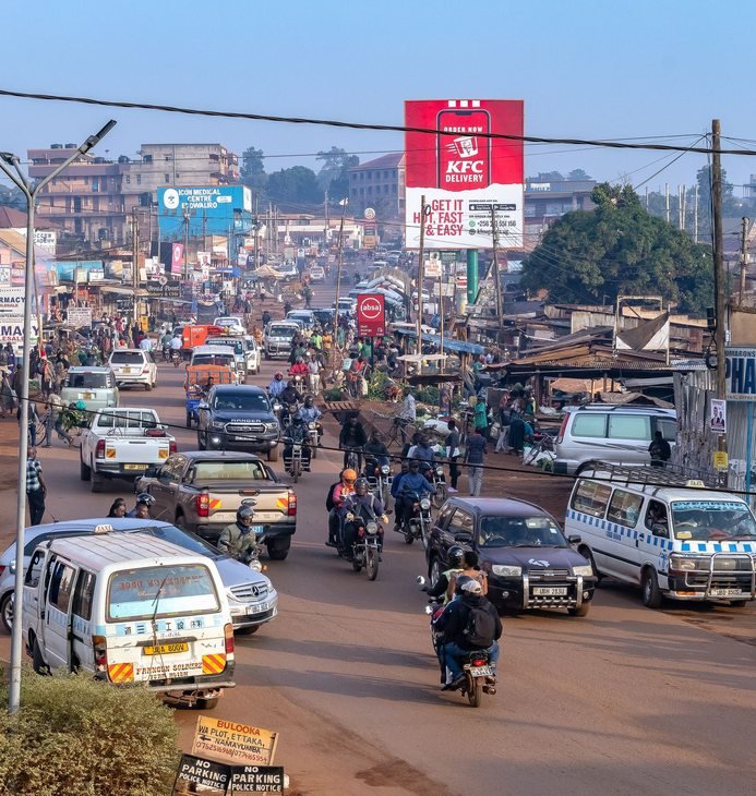 A busy Kampala street with local transport