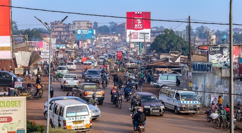 A busy Kampala street with local transport