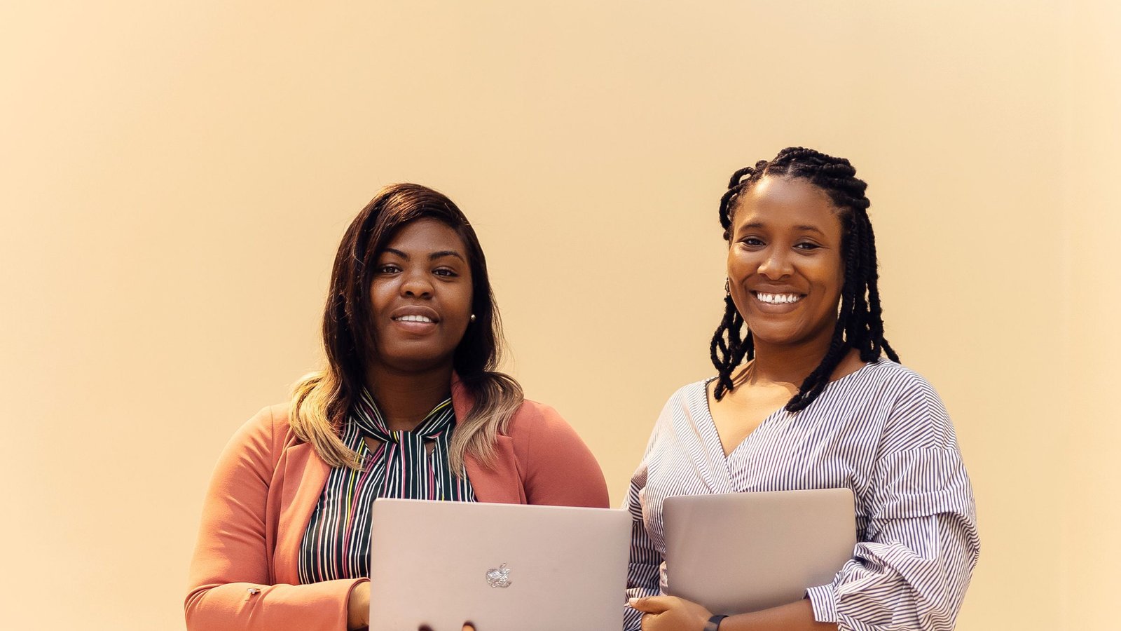 African businesswomen collaborating with laptops