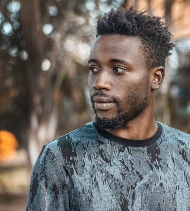 Man photographed outdoors in Kampala
