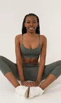 Black woman practising seated yoga