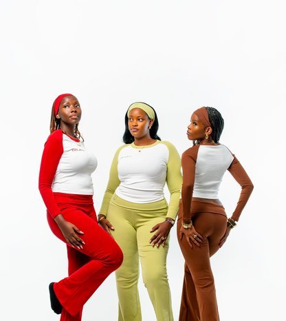 Three women in colourful outfits photographed in Kampala