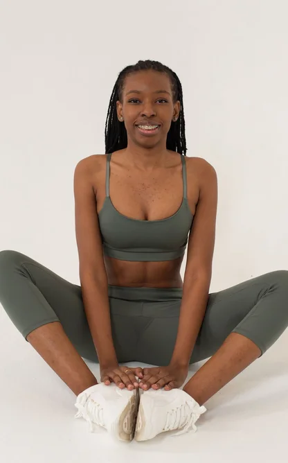 Black woman practising seated yoga