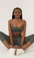 Black woman practising seated yoga