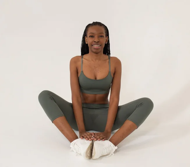 Black woman practising seated yoga