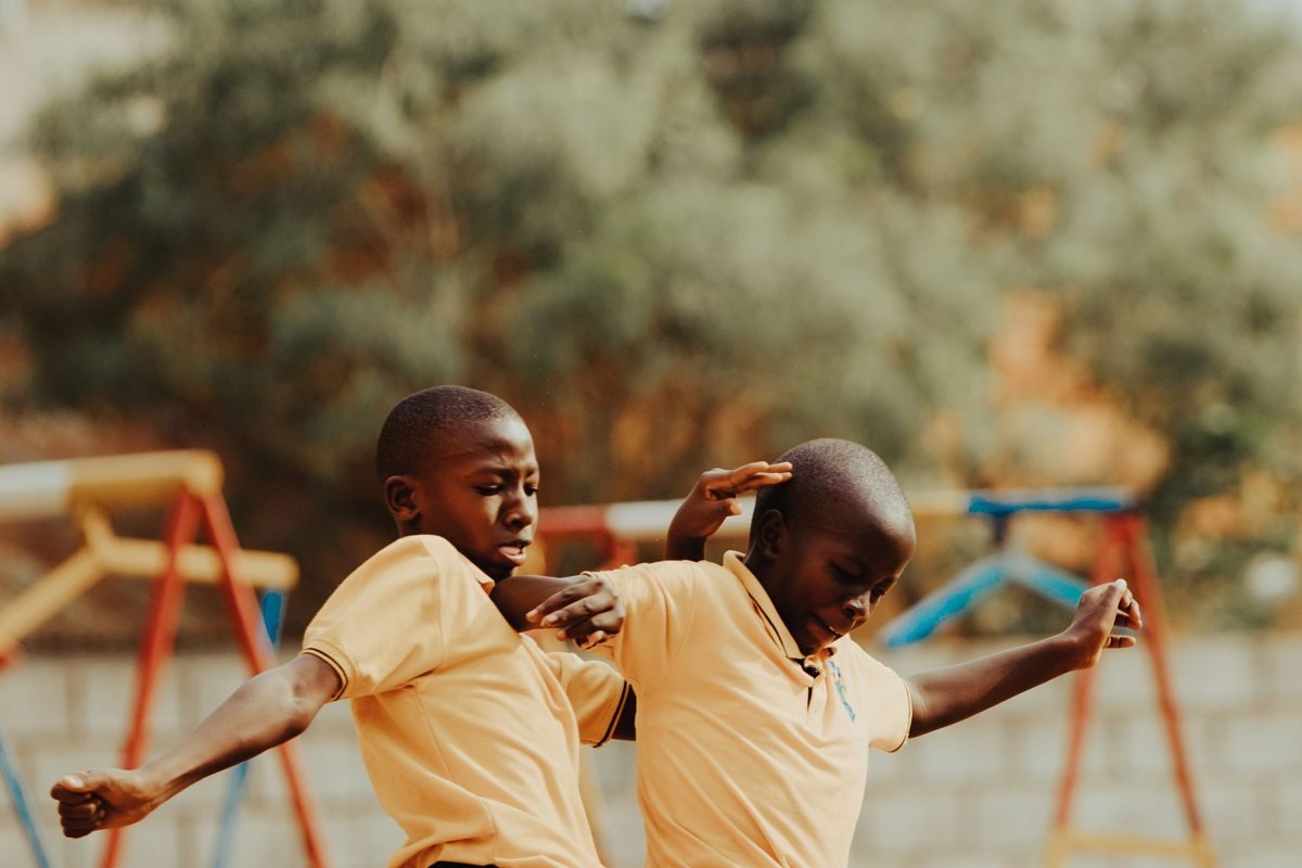 Children playing football in a Kampala schoolyard