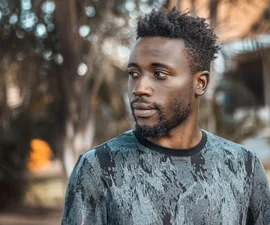 Man photographed outdoors in Kampala