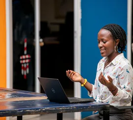 Woman using a laptop in Kampala
