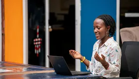 Woman using a laptop in Kampala