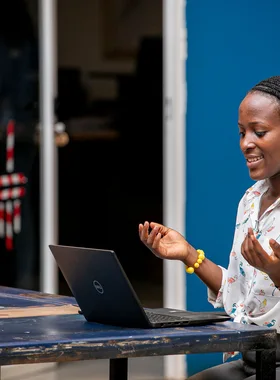 Woman using a laptop in Kampala
