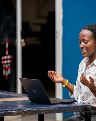 Woman using a laptop in Kampala