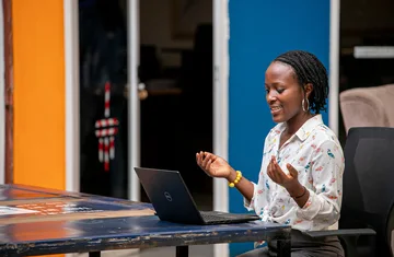 Woman using a laptop in Kampala