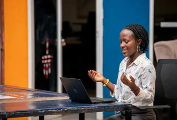 Woman using a laptop in Kampala