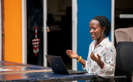 Woman using a laptop in Kampala