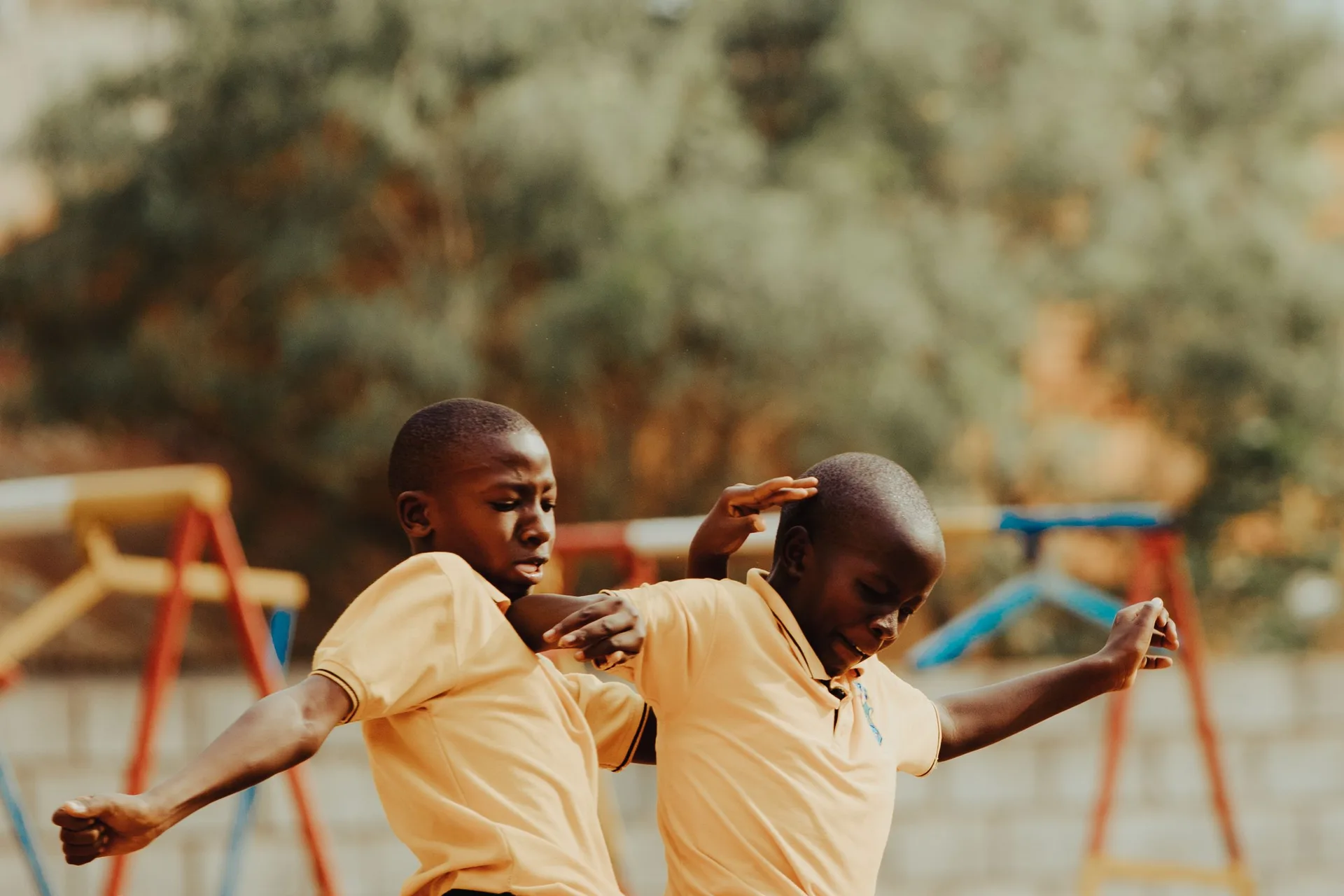 Children playing football in a Kampala schoolyard
