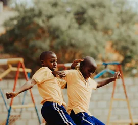 Children playing football in a Kampala schoolyard